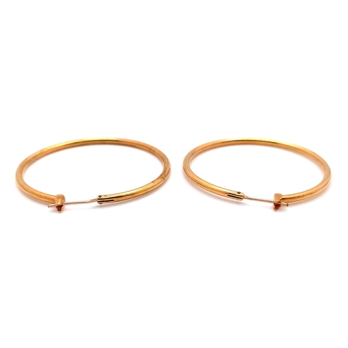 274 - A Pair of 18K Gold (tested) Hoop Earrings. 4cm diameter. 6.9g weight.