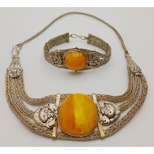 276 - A very attractive, white metal (untested), necklace and bracelet set with large amber coloured resin... 