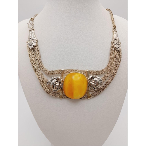 276 - A very attractive, white metal (untested), necklace and bracelet set with large amber coloured resin... 