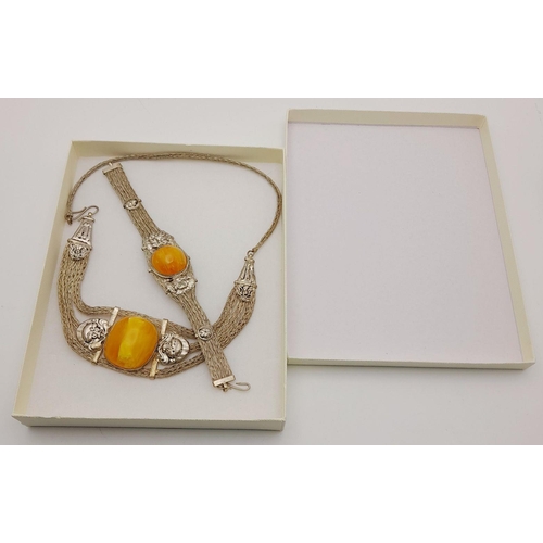 276 - A very attractive, white metal (untested), necklace and bracelet set with large amber coloured resin... 