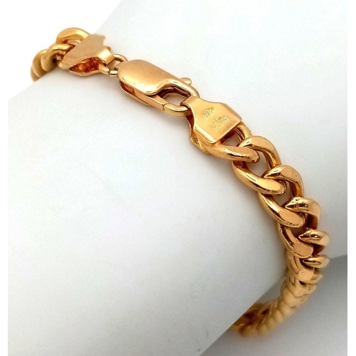 3 - An 18K Yellow Gold Curb Link Bracelet. In very good condition. 20cm length. 12.76g weight.