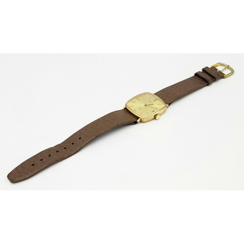 358 - A Vintage 9K Gold Rotary Gents Watch. Brown leather strap. 9K gold case - 28mm width. Gilded dial wi... 