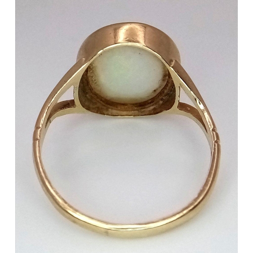 360 - A 9K Yellow Gold Opal Cabochon Ring. Size K. 2.1g total weight.