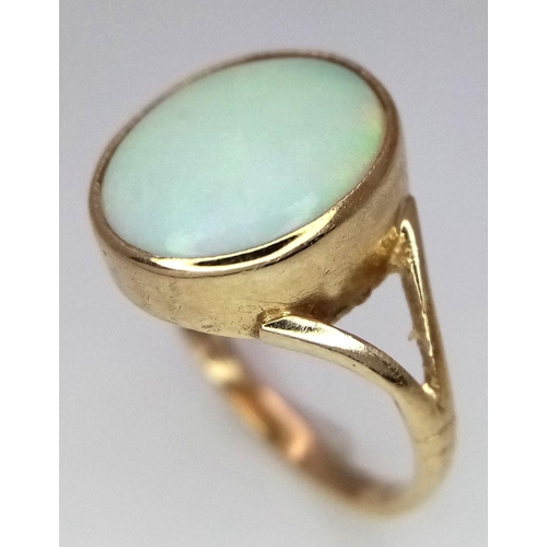 360 - A 9K Yellow Gold Opal Cabochon Ring. Size K. 2.1g total weight.