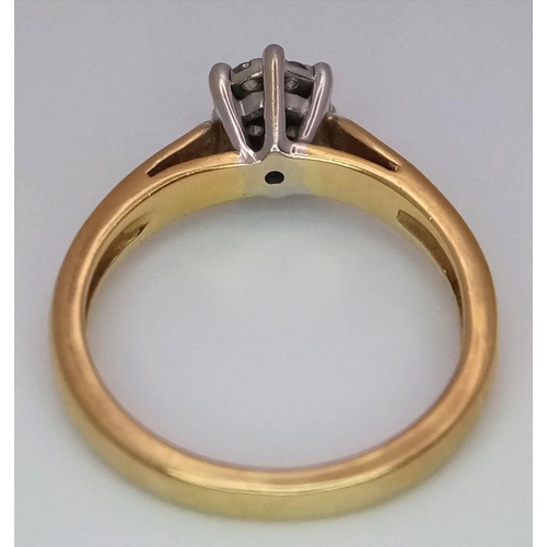 37 - An 18K Yellow Gold Diamond Ring. Seven small round cut diamonds. Size L. 3.25g total weight.