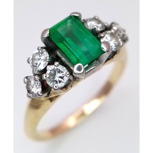 386 - An 18K Yellow Gold (tested), Emerald and Diamond Ring. 1ct central emerald with 0.6ctw of brilliant ... 