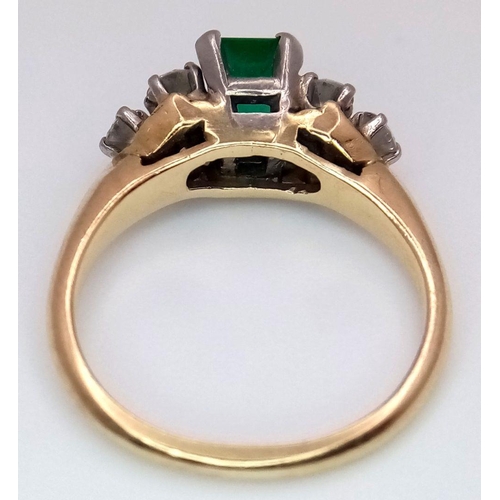 386 - An 18K Yellow Gold (tested), Emerald and Diamond Ring. 1ct central emerald with 0.6ctw of brilliant ... 