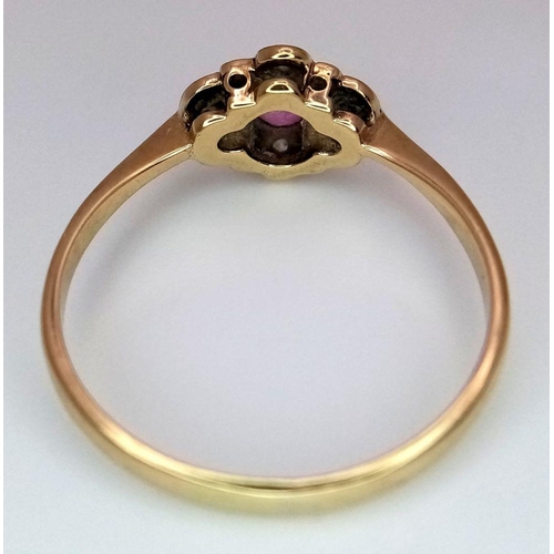 393 - An Antique 9K Yellow Gold, Platinum, Ruby and Diamond Ring. Size P. 1.65g total weight.