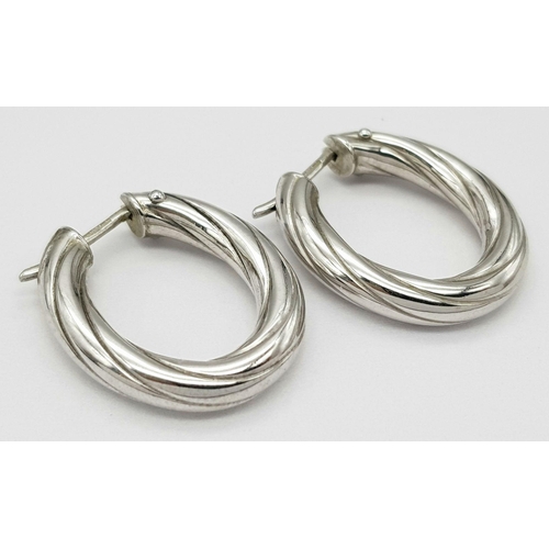 421 - A Pair of 9K White Gold Creole Earrings. 2cm. 3.1g total weight.