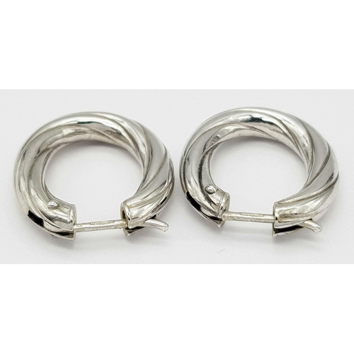 421 - A Pair of 9K White Gold Creole Earrings. 2cm. 3.1g total weight.