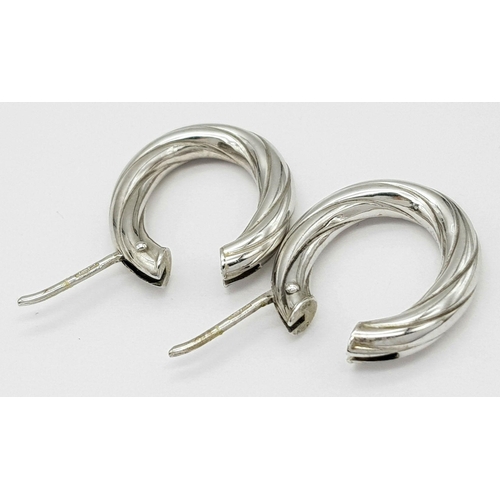 421 - A Pair of 9K White Gold Creole Earrings. 2cm. 3.1g total weight.