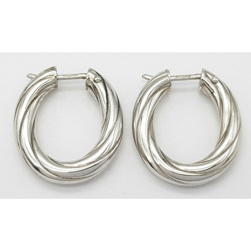 421 - A Pair of 9K White Gold Creole Earrings. 2cm. 3.1g total weight.