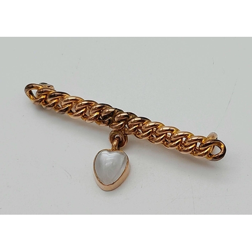 44 - An Antique 9K Yellow Gold and Moonstone Bar Brooch. 4cm. 2.4g total weight.