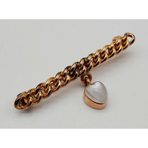 44 - An Antique 9K Yellow Gold and Moonstone Bar Brooch. 4cm. 2.4g total weight.