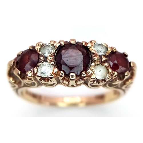 449 - A Vintage 9K Yellow Gold Garnet and Diamond Ring. Size M. 3.45g total weight.