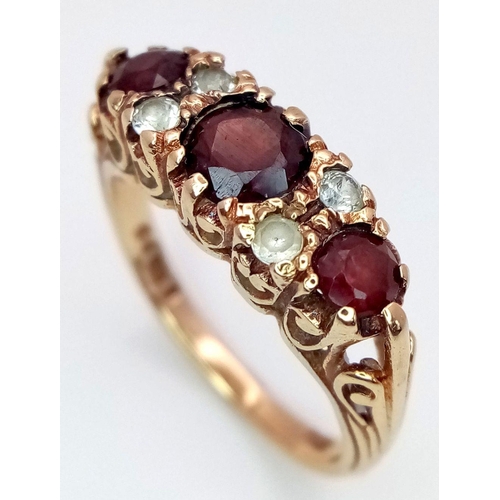 449 - A Vintage 9K Yellow Gold Garnet and Diamond Ring. Size M. 3.45g total weight.