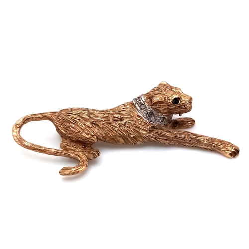 498 - A 9K Gold Leopard Brooch with Green and White Stone Decoration. 5cm. 7.9g weight.