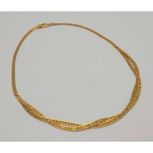 562 - A 9K Yellow Gold Crossover Flat Link Necklace. 36cm length. 12.45g weight.