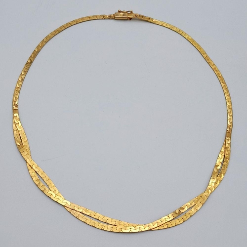 562 - A 9K Yellow Gold Crossover Flat Link Necklace. 36cm length. 12.45g weight.