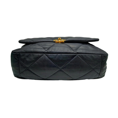 69 - A Large Chanel Quilted Black Leather Hand/Shoulder bag. Gold tone hardware. Outer pocket. Hand and s... 