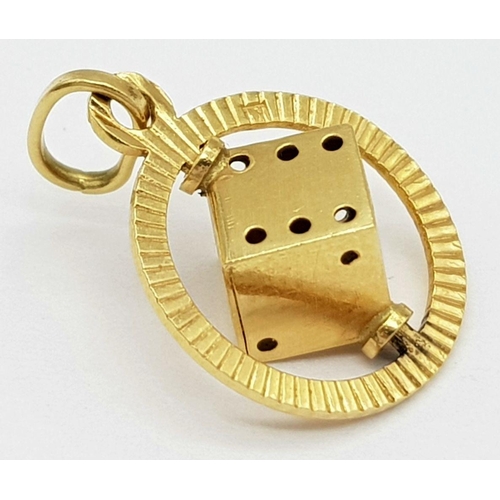 78 - An 18K Yellow Gold Spinning Dice Pendant. 20mm. 1.5g weight.