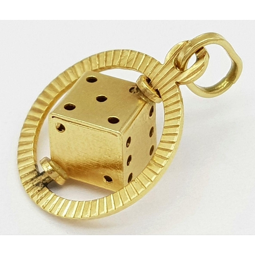 78 - An 18K Yellow Gold Spinning Dice Pendant. 20mm. 1.5g weight.