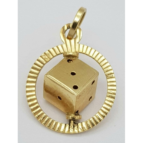 78 - An 18K Yellow Gold Spinning Dice Pendant. 20mm. 1.5g weight.