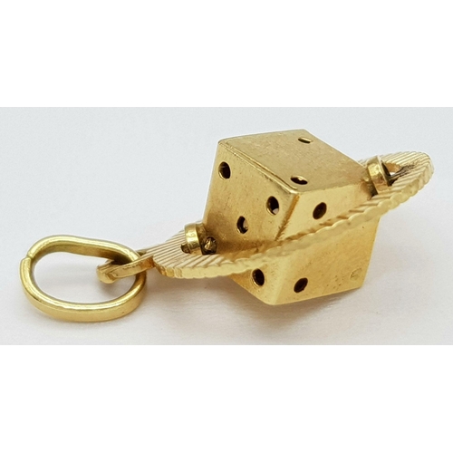 78 - An 18K Yellow Gold Spinning Dice Pendant. 20mm. 1.5g weight.