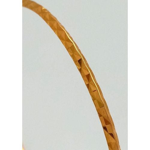 8 - A 22K Yellow Gold (tests as) Thin Bangle. 3mm width. 6cm inner diameter. 8.25g weight.