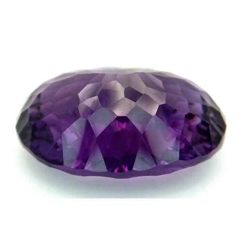 1129 - A 95.21ct Bolivian Amethyst Gemstone. Oval shape, concave cut. Comes with GFCO certificate. Ref: ZK ... 