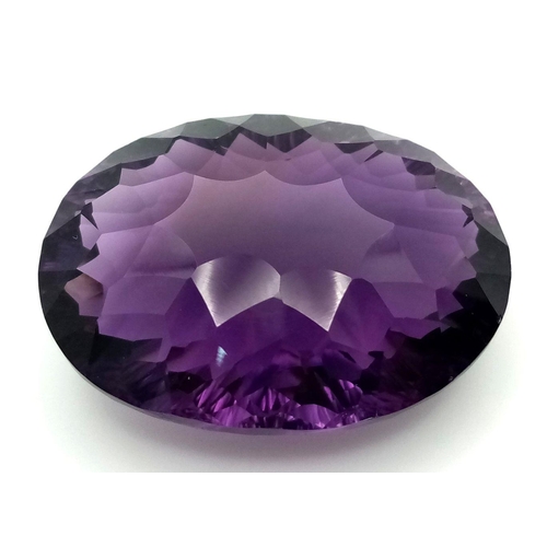 1129 - A 95.21ct Bolivian Amethyst Gemstone. Oval shape, concave cut. Comes with GFCO certificate. Ref: ZK ... 