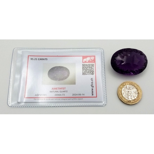 1129 - A 95.21ct Bolivian Amethyst Gemstone. Oval shape, concave cut. Comes with GFCO certificate. Ref: ZK ... 