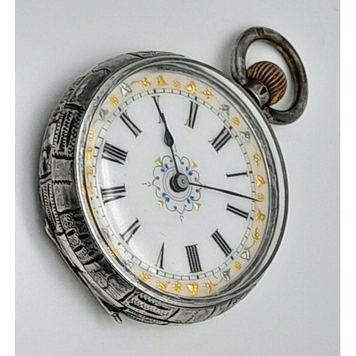 1330 - A Miniature Antique Silver Pocket Watch. Case silver mark of 965. White ornate gilded dial. 38mm dia... 