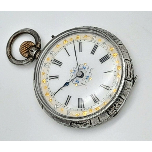 1330 - A Miniature Antique Silver Pocket Watch. Case silver mark of 965. White ornate gilded dial. 38mm dia... 