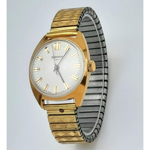 1351 - A Vintage Sekonda Manuel-Wind Gents Watch. Expandable bracelet. Gilded case - 35mm. White dial. In w... 