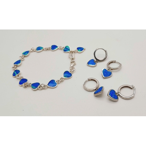 1382 - A matching set of 925 silver Opal jewellery include 2 pairs of hoop earrings and a  link bracelet (1... 