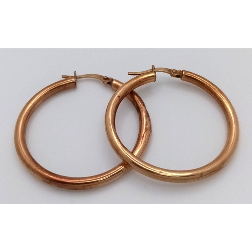 1395 - A Pair of 9K Yellow Gold Hoop Earrings. 3cm diameter. 1.8g weight.