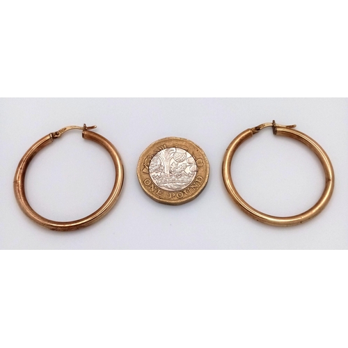 1395 - A Pair of 9K Yellow Gold Hoop Earrings. 3cm diameter. 1.8g weight.