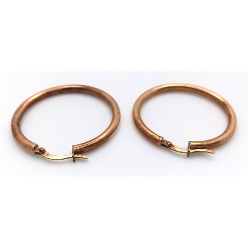 1395 - A Pair of 9K Yellow Gold Hoop Earrings. 3cm diameter. 1.8g weight.