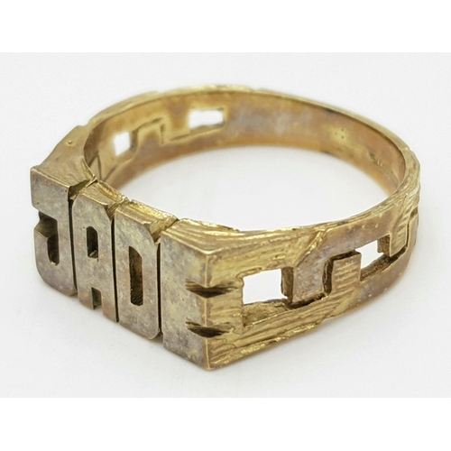 1353 - A 9K Gold 'Jade' Name Ring. Size M 1/2. 3.7g weight.