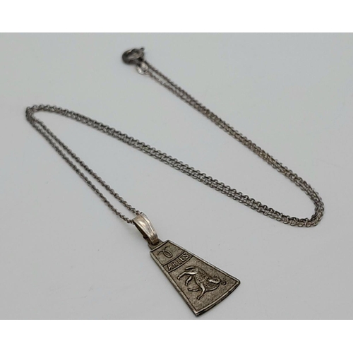 1562 - A vintage silver Aries sign pendant on 935 silver chain. Total weight 2.9G. Total length 44cm.