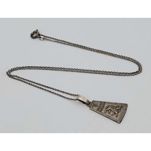 1562 - A vintage silver Aries sign pendant on 935 silver chain. Total weight 2.9G. Total length 44cm.