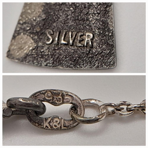 1562 - A vintage silver Aries sign pendant on 935 silver chain. Total weight 2.9G. Total length 44cm.