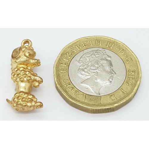 1598 - A 9K Yellow Gold Poodle Pendant/Charm. 20mm. 0.8g.