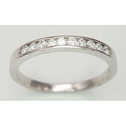 222 - AN 18K WHITE GOLD DIAMOND HALF ETERNITY RING. 0.20CT. 2.3G IN WEIGHT. SIZE Q AND 1/2. Ref: SC 6099