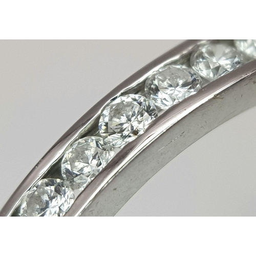 222 - AN 18K WHITE GOLD DIAMOND HALF ETERNITY RING. 0.20CT. 2.3G IN WEIGHT. SIZE Q AND 1/2. Ref: SC 6099