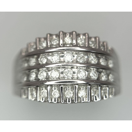 418 - A 9K WHITE GOLD DIAMOND SET 4 ROW BAND RING 0.25CT. 4.6G IN WEIGHT. SIZE O. Ref: SC 6033.