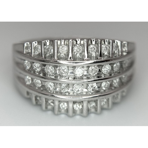 418 - A 9K WHITE GOLD DIAMOND SET 4 ROW BAND RING 0.25CT. 4.6G IN WEIGHT. SIZE O. Ref: SC 6033.