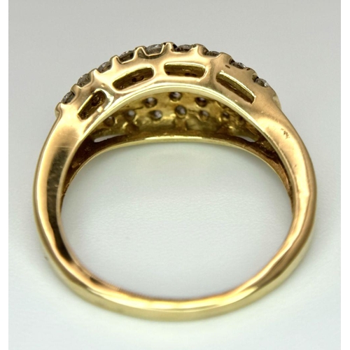 425 - A 9K YELLOW GOLD DIAMOND SET RING 0.65CT. 4.6G IN WEIGHT. SIZE N AND 1/2. Ref: SC 6040