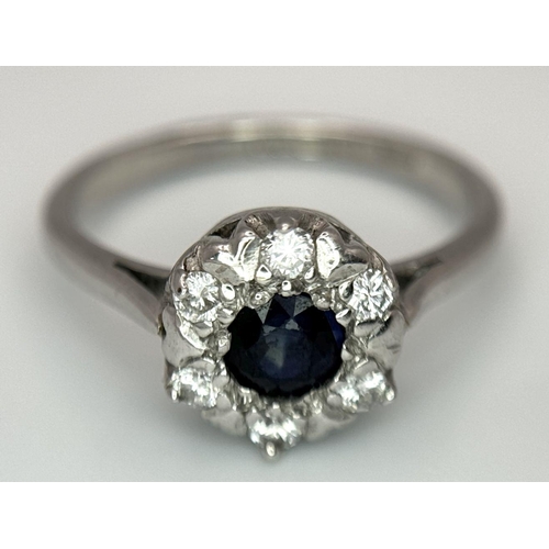 445 - AN 18K WHITE GOLD DIAMOND & SAPPHIRE CLUSTER RING 4.2G SIZE O 1/2. Ref: SC 6024